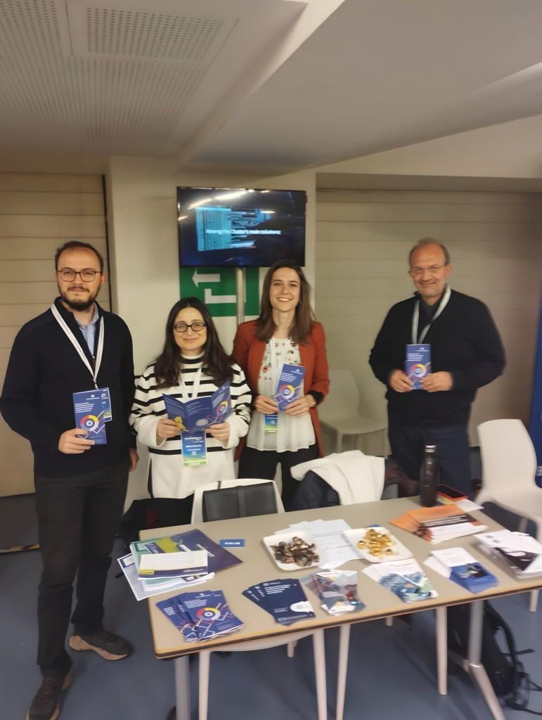 Four representatives of the SYNCHROMODE project with leaflets on the Connecting Europe Days.